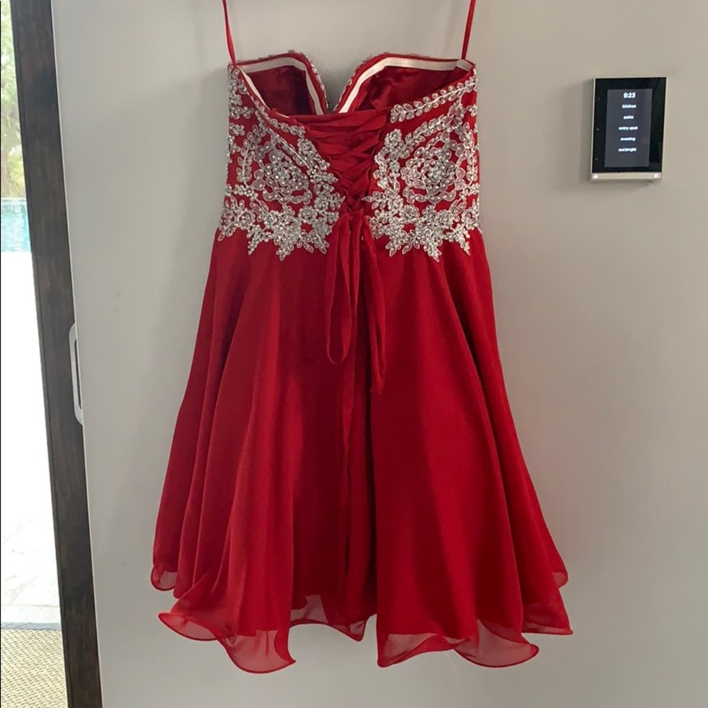 Beautiful red and silver sequined cocktail dress.